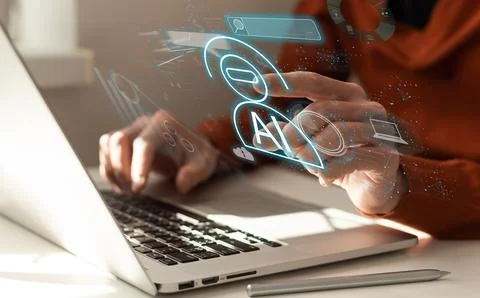 Woman using computer chatting with an intelligent artificial intelligence asks Stock Photos