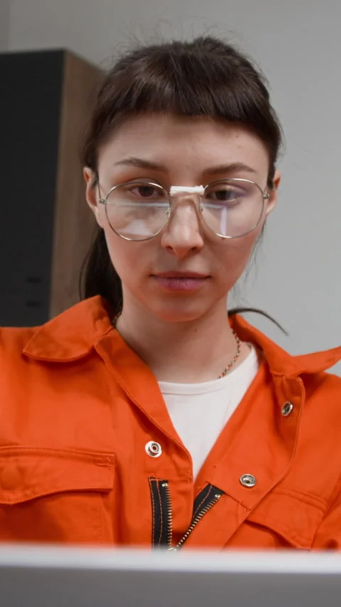 Woman Using Computer during Programming Class in Correctional Facility Vertical Stock Footage 329002931