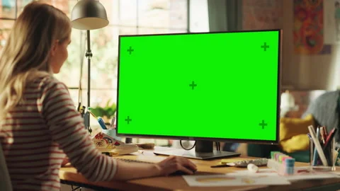Woman Using Computer With Green Screen Stock Footage 195106115