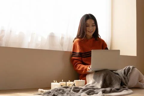 A woman  using a computer keyboard. She works from home. Stock Photos