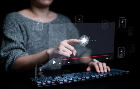 Woman using computer keyboard for streaming on virtual screen, watching vid.. Stock Photos