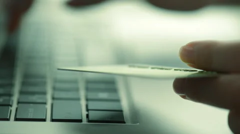 Woman using computer for on line purchase with credit card. Toned in blue color Stock Footage 49120941