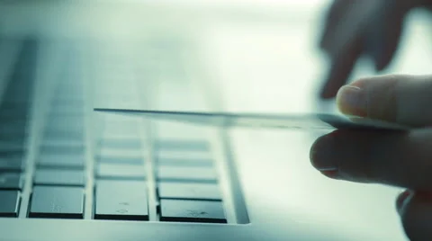 Woman using computer for on line purchase with credit card. Toned in blue color Stock Footage 49121491