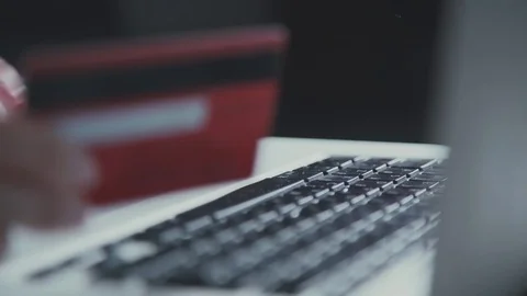 Woman using computer for on line purchase with credit card Video stock 70416295