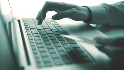 Woman using computer for on line purchase with credit card. Toned in blue color Video stock 87836688