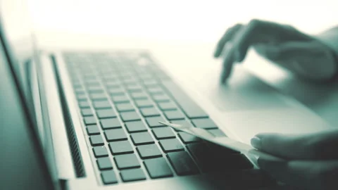 Woman using computer for on line purchase with credit card. Toned in blue color Video stock 87836840