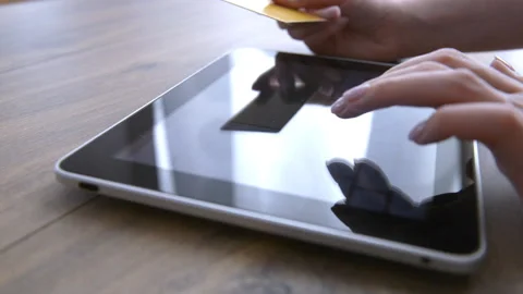 Woman using computer for on line purchase with credit card Stock Footage 88825582