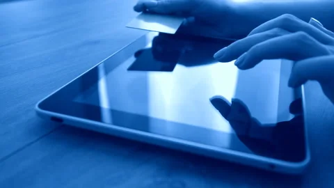Woman using computer for on line purchase with credit card Stock Footage 88825626