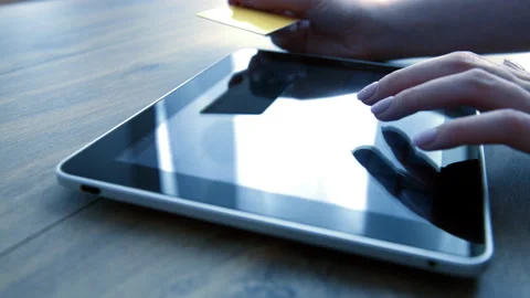Woman using computer for on line purchase with credit card Stock Footage 88825726