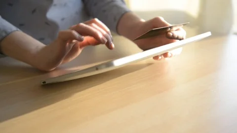 Woman using computer for on line shopping with credit card Stock Footage 73736600