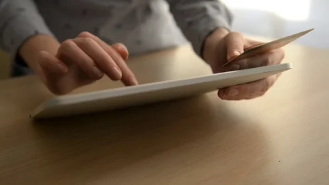 Woman using computer for on line shopping with credit card Stock Footage 73736796