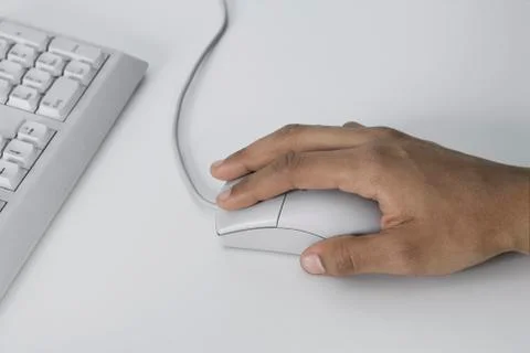 Woman using computer mouse Stock Photos