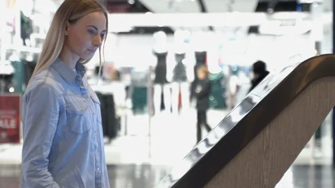 Woman using computer touch screen information in store Stock Footage 121276911