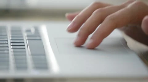 Woman using a computer trackpad Stock Footage 65731554