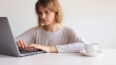 Woman using computer on white Stock Footage 109205797