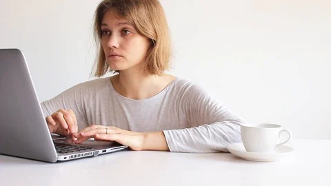 Woman using computer on white Stock Footage 109205809
