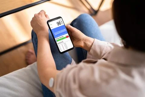 Woman Using Continuous Glucose Remote Monitor Diabetes Stock Photos