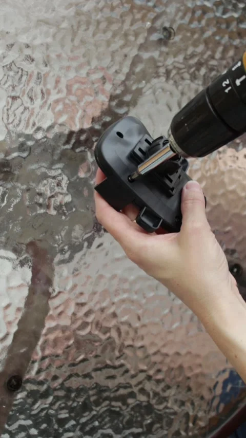 Woman using a cordless power screwdriver to fasten a screw. Video stock 324247248