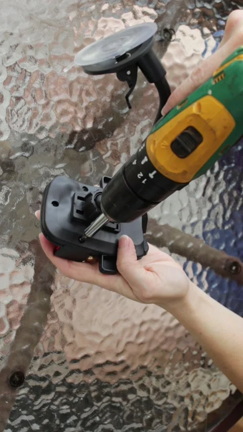 Woman using a cordless power screwdriver to remove a screw. Video stock 324247253