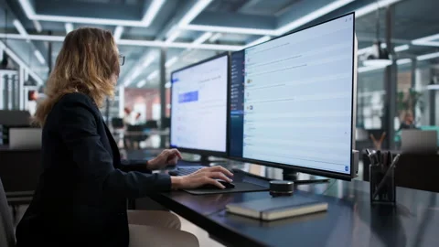 Woman Using Corporate Messaging Software And Email To Communicated Stock Footage 329300775