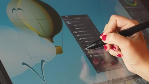 Woman using creative pen display to edit a vector design, close-up, FHD Stock Footage 143486230