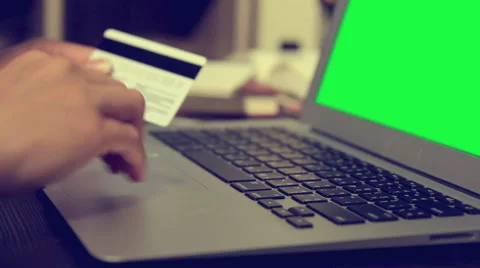 Woman using credit card with laptop green screen shopping online Stock Footage 64778853