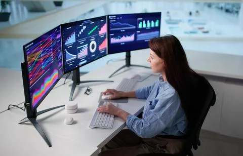 Woman Using Data Analytics Dashboard For Financial Markets Analysis Stock Photos