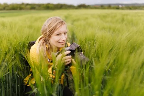 Woman using digital camera for making photos on fresh air Stock Photos
