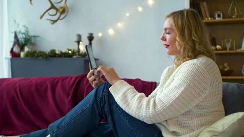 Woman is using digital computer tablet at home Video stock 194741913