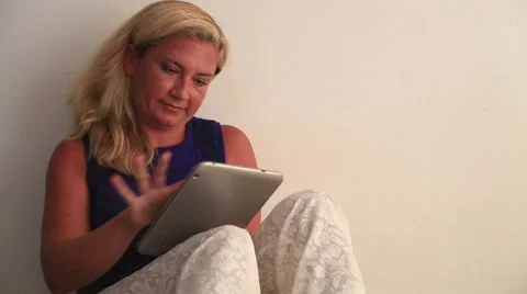 Woman using digital tablet and dreaming Stock Footage 41468510