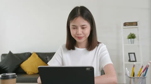 Woman using digital tablet and video call with learning online on internet. 스톡 동영상 135503388