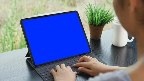 Woman using digital tablet blue screen 4k Stock Footage 123513733