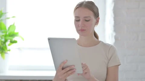 Woman using Digital Tablet, Browsing Internet Stock-Footage 205000286