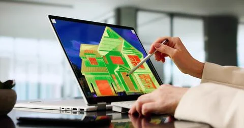 Woman Using Digital Tablet To Capture Image Of Thermal Insulation. Possible P Stock Photos