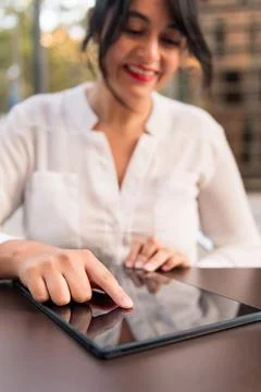 Woman using digital tablet, focus on the device Stock Photos