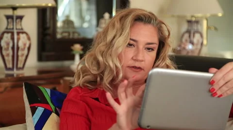 Woman using digital tablet Stock Footage 56635210