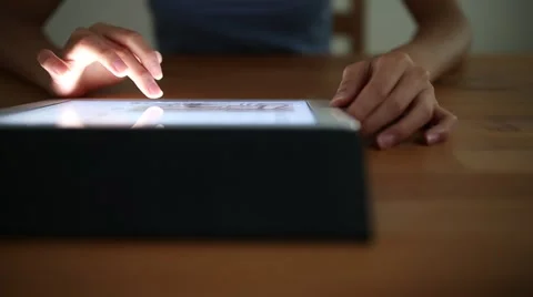Woman using digital tablet Stock Footage 64997203