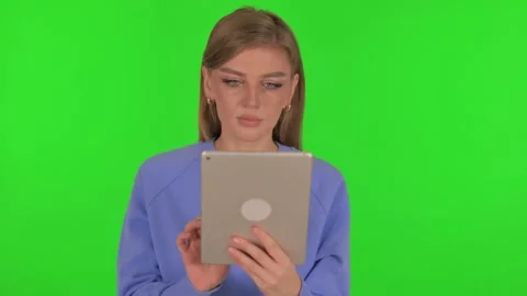 Woman Using Digital Tablet on Green Background Video stock 295894301