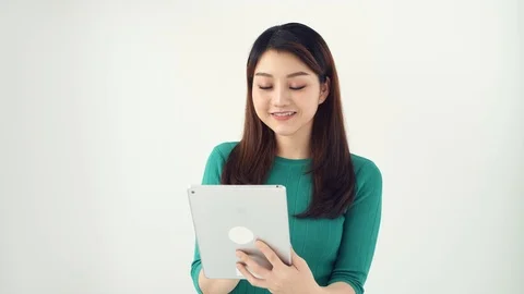 Woman using digital tablet isolated on white Stock Footage 125069253