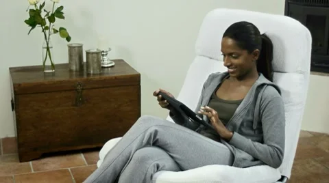 Woman using digital tablet pc at home Stock Footage 7907671