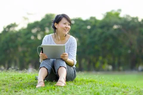 Woman using digital tablet Stock Photos