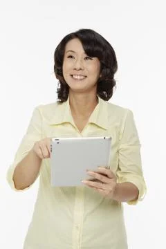 Woman using a digital tablet Stock Photos