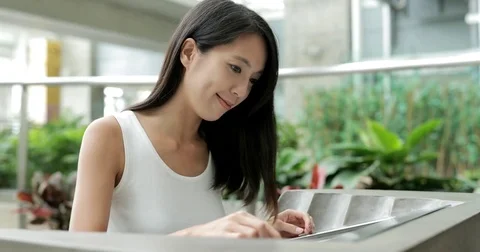 Woman using directory in the shopping mall Stock Footage