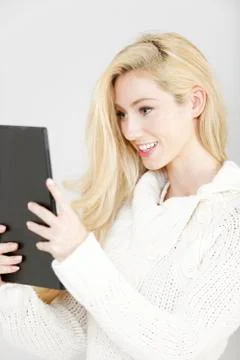 Woman using an electronic tablet 写真素材