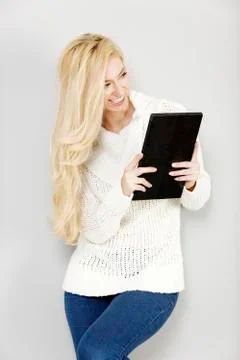 Woman using an electronic tablet Stock Photos