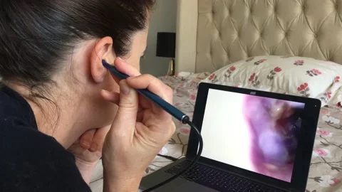 Woman using endoscope visual ear cleaner Stock Footage 167714052