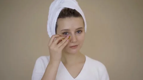 Woman Using Gel Eye Patch Mask. Beautiful woman using facial mask beauty product Stock Footage 142200823
