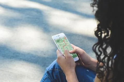 Woman using GPS map navigation app with planned route Stock Photos
