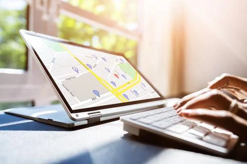 Woman Using GPS Map With Navigation Pointers On Laptop Stock Photos