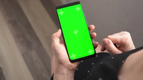 Woman using green screen chroma key smartphone in vertical position close up Video stock 240921270